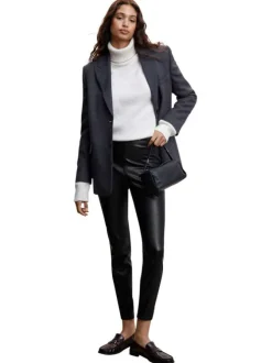 Pantalon noir uni avec une coupe skinny et un zip sur le côté