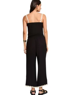 Pantalon noir uni pourvu de finitions festonnées contrastées