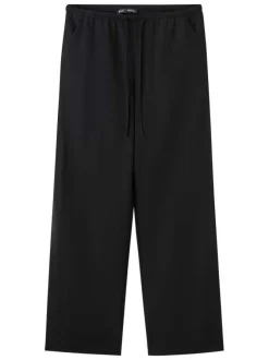 Pantalon noir uni pourvu d'une coupe droite et d'une taille élastiquée