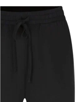 Pantalon noir uni pourvu d'une coupe large et d'une taille élastiquée