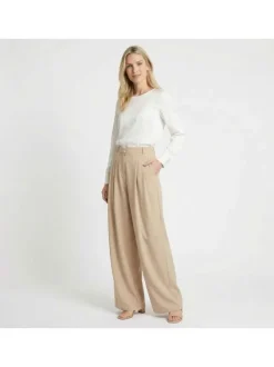 Pantalon Paline beige uni pourvu d'une coupe large et d'une taille haute