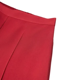 Pantalon rouge uni avec une coupe bootcut et une taille élastiquée