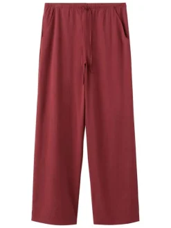 Pantalon rouge uni pourvu d'une coupe droite et d'une taille élastiquée