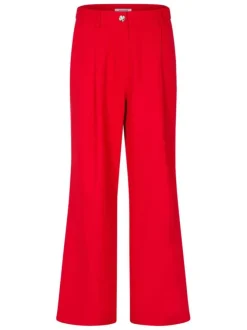 Pantalon rouge uni pourvu d'une coupe large et de détails plissés