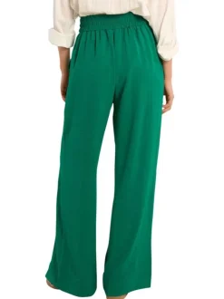 Pantalon vert uni pourvu d'une coupe large et d'une taille haute