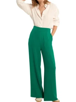 Pantalon vert uni pourvu d'une coupe large et d'une taille haute