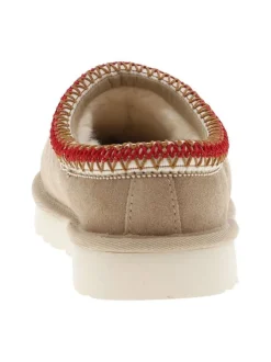 Pantoufles tasman en cuir beige avec logo iconique embossé sur le côté