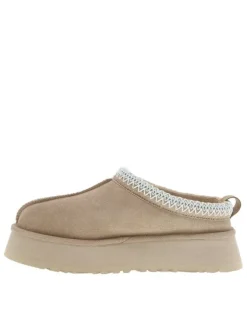 Pantoufles Tazz en cuir beige avec une semelle à plateforme et logo embossé
