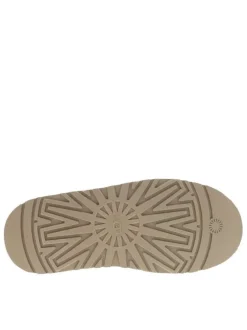 Pantoufles Tazz en cuir beige avec une semelle à plateforme et logo embossé