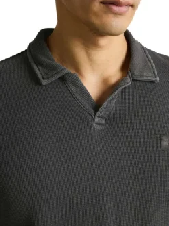 Polo anthracite uni pourvu d'une coupe droite et de manches courtes