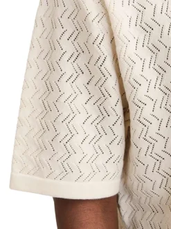 Polo beige à coupe droite pourvu d'un col à revers et de manches courtes