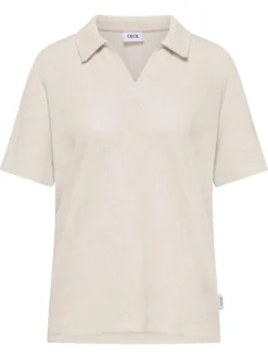 Polo beige uni pourvu de manches courtes et d'un col v à revers