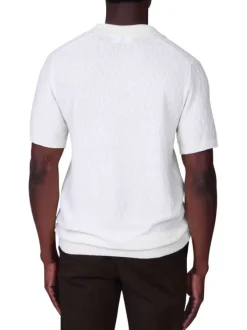 Polo blanc à coupe droite pourvu d'un col V et de manches courtes