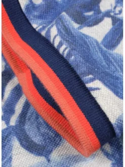 Polo blanc en coton maille piquée avec imprimé feuilles tropicales all-over coupe droite