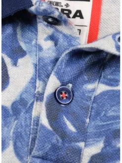 Polo blanc en coton maille piquée avec imprimé feuilles tropicales all-over coupe droite