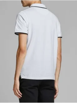Polo blanc uni en coton avec une coupe droite avec liseré noir sur le col et les manches