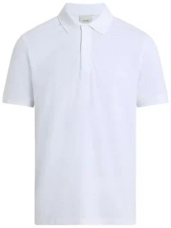 Polo blanc uni en maille piquée fermé par deux boutons avec une coupe droite