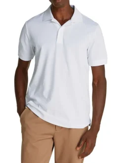 Polo blanc uni en maille piquée fermé par deux boutons avec une coupe droite