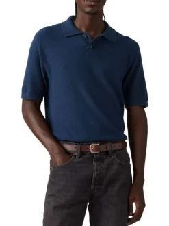 Polo bleu marine uni à coupe droite et à col fermé par deux boutons