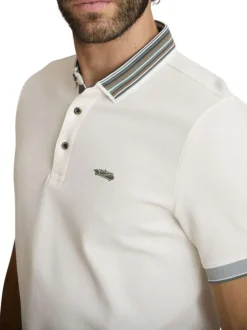 Polo en coton beige à coupe droite pourvu d'un col à revers boutonné