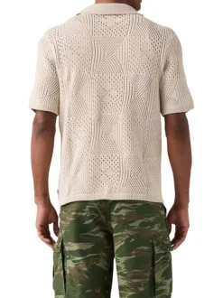 Polo en coton beige à coupe droite pourvu d'un col à revers côtelé