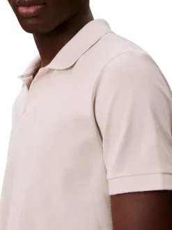 Polo en coton beige à coupe droite pourvu d'un col v bord-côte