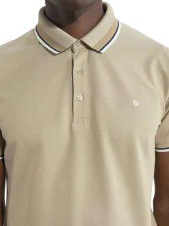 Polo en coton beige en maille piquée à coupe droite avec un col à revers