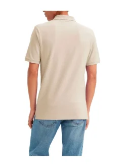 Polo en coton beige uni avec une coupe slim fit et patch cousu sur la poitrine
