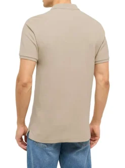Polo en coton beige uni pourvu d'une coupe droite et d'un col boutonné