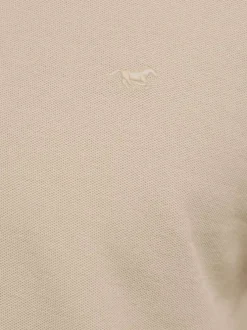 Polo en coton beige uni pourvu d'une coupe droite et d'un col boutonné