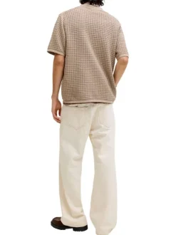 Polo en coton biologique beige à coupe droite pourvu d'un col à revers