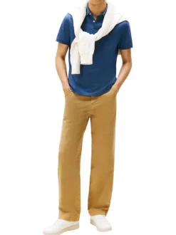 Polo en coton biologique bleu à coupe ajustée pourvu d'un col boutonné