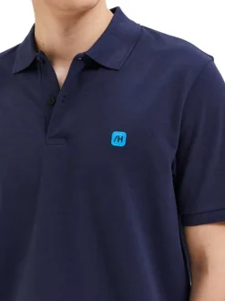 Polo en coton biologique maille piquée marine à coupe droite et col boutonné