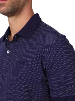 Polo en coton biologique marine uni avec une coupe droite et un col boutonné
