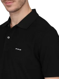 Polo en coton biologique noir uni avec une coupe droite et un col à revers
