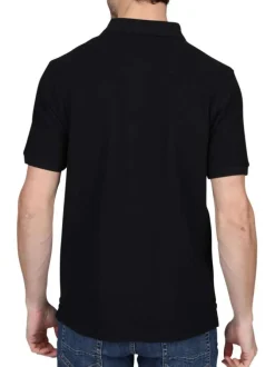 Polo en coton biologique noir uni avec une coupe droite et un col à revers