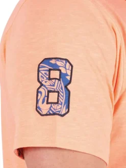 Polo en coton biologique orange uni pourvu d'un col boutonné