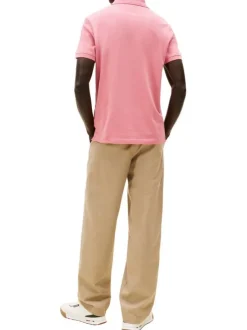 Polo en coton biologique rose à coupe ajustée pourvu d'un col boutonné