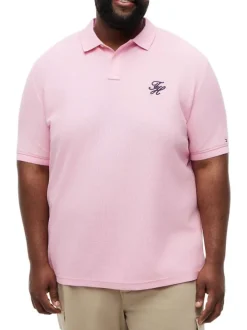 Polo en coton biologique rose uni pourvu d'une coupe droite et d'un col boutonné