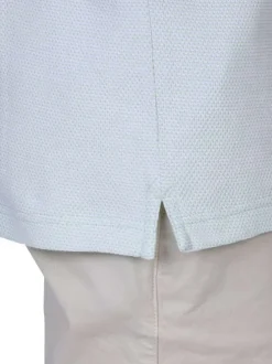 Polo en coton biologique vert d'eau à coupe droite pourvu d'un col boutonné