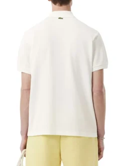 Polo en coton blanc avec un motif une coupe droite et un col à revers