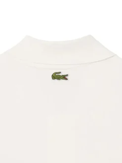 Polo en coton blanc avec un motif une coupe droite et un col à revers