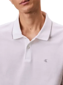 Polo en coton blanc à coupe droite pourvu d'un col à revers boutonné