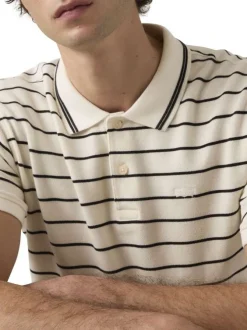 Polo en coton blanc à rayures avec une coupe droite et un col boutonné
