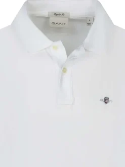 Polo en coton blanc uni avec une coupe droite et le logo brodé à la poitrine