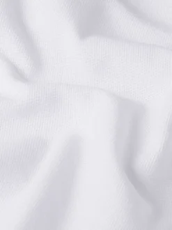Polo en coton blanc uni avec une coupe droite et un col boutonné