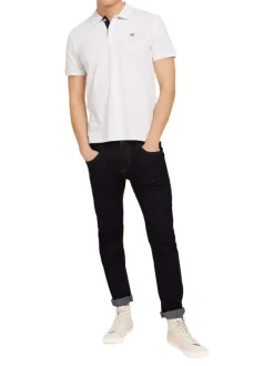 Polo en coton blanc uni coupe droite avec un col fermé par 2 boutons