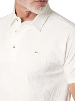 Polo en coton blanc uni pourvu d'une coupe droite et d'un col boutonné