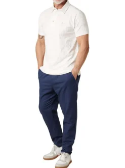 Polo en coton blanc uni pourvu d'une coupe droite et d'un col boutonné