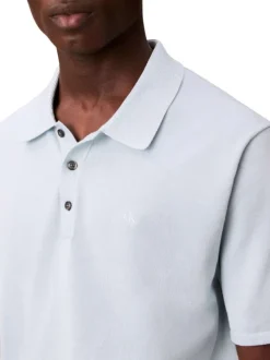 Polo en coton bleu ciel uni à coupe légèrement oversize avec le logo brodé